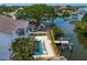 Waterfront home with a private pool, dock, and boat lift; perfect for enjoying outdoor activities at 1739 1/2 Bayou Grande Ne Blvd, St Petersburg, FL 33703