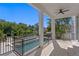 Outdoor balcony overlooking a sparkling pool and lush tropical landscaping at 1739 1/2 Bayou Grande Ne Blvd, St Petersburg, FL 33703