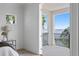 Bedroom boasts a private balcony offering relaxing water views and seamless indoor-outdoor living at 1739 1/2 Bayou Grande Ne Blvd, St Petersburg, FL 33703