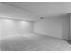 Spacious basement area with carpet and ample lighting at 1739 1/2 Bayou Grande Ne Blvd, St Petersburg, FL 33703