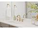 Bathroom sink area features bright marble countertops, modern fixtures, and stylish décor, with hand towels at 1739 1/2 Bayou Grande Ne Blvd, St Petersburg, FL 33703