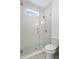 Bright bathroom with a tiled shower and modern fixtures at 1739 1/2 Bayou Grande Ne Blvd, St Petersburg, FL 33703