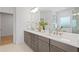 Bathroom features double sinks, marble countertop, and modern fixtures, with a walk-in shower and luxury finishes at 1739 1/2 Bayou Grande Ne Blvd, St Petersburg, FL 33703