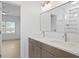 Double vanity bathroom with modern fixtures, granite countertops, and sleek design and a bedroom doorway at 1739 1/2 Bayou Grande Ne Blvd, St Petersburg, FL 33703