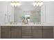 Bathroom boasts double sinks, marble countertop, and modern fixtures, with a walk-in shower and luxury finishes at 1739 1/2 Bayou Grande Ne Blvd, St Petersburg, FL 33703