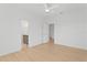 Bright and airy bedroom with ensuite bathroom, featuring light wood flooring and neutral tones at 1739 1/2 Bayou Grande Ne Blvd, St Petersburg, FL 33703