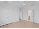 A bedroom with wood flooring features an ensuite bathroom and a walk-in closet at 1739 1/2 Bayou Grande Ne Blvd, St Petersburg, FL 33703