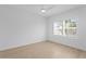 A bedroom featuring wood floors, ceiling fan, and plantation window shutters for natural lighting at 1739 1/2 Bayou Grande Ne Blvd, St Petersburg, FL 33703