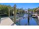 A private boat lift on a sunny day offers a convenient amenity for waterfront living at 1739 1/2 Bayou Grande Ne Blvd, St Petersburg, FL 33703