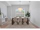 Elegant dining room featuring a modern chandelier and stylish furnishings at 1739 1/2 Bayou Grande Ne Blvd, St Petersburg, FL 33703