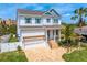 Beautifully landscaped two-story home with a brick driveway at 1739 1/2 Bayou Grande Ne Blvd, St Petersburg, FL 33703