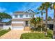 Stunning two-story home with a manicured lawn and beautiful landscaping at 1739 1/2 Bayou Grande Ne Blvd, St Petersburg, FL 33703