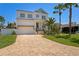 Charming two-story home with a brick driveway and lush landscaping at 1739 1/2 Bayou Grande Ne Blvd, St Petersburg, FL 33703