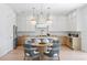 Gourmet kitchen featuring a center island with seating, pendant lights, and modern appliances at 1739 1/2 Bayou Grande Ne Blvd, St Petersburg, FL 33703