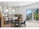 Bright, modern kitchen featuring a center island, stainless steel appliances, and water view at 1739 1/2 Bayou Grande Ne Blvd, St Petersburg, FL 33703