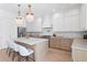 Spacious kitchen with a center island, modern appliances, and beautiful backsplash at 1739 1/2 Bayou Grande Ne Blvd, St Petersburg, FL 33703