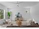 Bright open concept living room with modern furnishings, neutral decor, and hardwood floors at 1739 1/2 Bayou Grande Ne Blvd, St Petersburg, FL 33703