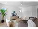 Bright and airy living room with modern decor, plush seating, and ample natural light at 1739 1/2 Bayou Grande Ne Blvd, St Petersburg, FL 33703