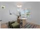 Bright home office with modern decor, plush seating, and ample natural light at 1739 1/2 Bayou Grande Ne Blvd, St Petersburg, FL 33703