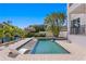 Backyard pool with a spa, poolside lounge chairs, and a tiki hut at 1739 1/2 Bayou Grande Ne Blvd, St Petersburg, FL 33703