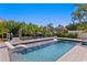 Beautiful backyard pool featuring lounge chairs, a spa, and lovely tropical landscaping at 1739 1/2 Bayou Grande Ne Blvd, St Petersburg, FL 33703
