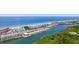 Stunning aerial view showcasing the beach, ocean, and adjacent waterway with the city in the distance at 18400 Gulf Blvd # 1109, Indian Shores, FL 33785