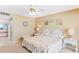 Cozy bedroom with a queen bed and coastal-themed decor, complemented by neutral walls and white furniture at 18400 Gulf Blvd # 1109, Indian Shores, FL 33785
