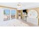 Bright bedroom featuring a beachfront view from the private balcony, with cozy white wicker furniture at 18400 Gulf Blvd # 1109, Indian Shores, FL 33785