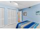 Bright bedroom with closet and an open doorway at 18400 Gulf Blvd # 1109, Indian Shores, FL 33785