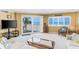 Cozy living room with ocean views through a sliding door leading to the balcony at 18400 Gulf Blvd # 1109, Indian Shores, FL 33785