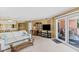 Bright living room with a view of the balcony and the dining area adjacent at 18400 Gulf Blvd # 1109, Indian Shores, FL 33785
