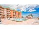 A refreshing pool with lounge chairs is steps away from the beach offering relaxation and fun at 18400 Gulf Blvd # 1109, Indian Shores, FL 33785