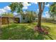 Backyard with mature landscaping and a privacy fence at 19246 Meadow Pine Dr, Tampa, FL 33647