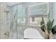 Modern bathroom features glass enclosed shower, and white marble at 19246 Meadow Pine Dr, Tampa, FL 33647