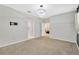 Spacious bedroom offering a modern ceiling light and ensuite bathroom access at 19246 Meadow Pine Dr, Tampa, FL 33647