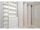 Bright walk-in closet with shelving, drawers, and hanging rods for optimal organization at 19246 Meadow Pine Dr, Tampa, FL 33647