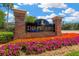 Community entrance sign for The Preserve with colorful flower beds and brick columns at 19246 Meadow Pine Dr, Tampa, FL 33647