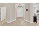 Welcoming foyer featuring tile floors, a decorative light fixture, and a view of the front door at 19246 Meadow Pine Dr, Tampa, FL 33647