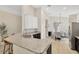 Open-concept kitchen and dining area featuring granite countertops and stainless steel appliances at 19246 Meadow Pine Dr, Tampa, FL 33647