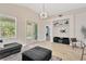 Bright living room features tile flooring, a modern light fixture, and direct access to the outdoors at 19246 Meadow Pine Dr, Tampa, FL 33647