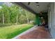 Outdoor patio with a fan, and a backyard view with a hanging chair at 19246 Meadow Pine Dr, Tampa, FL 33647