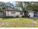Inviting single-story home with a well-kept lawn and an attached one car garage at 2167 Euclid E Cir, Clearwater, FL 33764