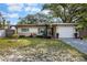 Charming one-story home with a well-manicured lawn and attached one car garage at 2167 Euclid E Cir, Clearwater, FL 33764