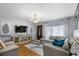 Bright living room with a sectional couch, hardwood floors and neutral decor at 2167 Euclid E Cir, Clearwater, FL 33764