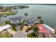 Stunning waterfront homes with lush landscaping and private docks surrounded by beautiful bay waters at 2250 Donato Dr, Belleair Beach, FL 33786