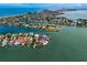 Scenic aerial view of waterfront properties with private docks in a picturesque bay neighborhood at 2250 Donato Dr, Belleair Beach, FL 33786