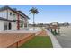A tropical backyard featuring an in-ground swimming pool and a waterfront wood deck at 2250 Donato Dr, Belleair Beach, FL 33786
