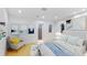 Bright bedroom featuring arched windows with picturesque waterfront views and modern decor at 2250 Donato Dr, Belleair Beach, FL 33786