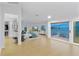 Expansive main bedroom boasting water views, a walk-in closet, and balcony access through sliding glass doors at 2250 Donato Dr, Belleair Beach, FL 33786