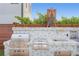 Gourmet outdoor kitchen with stainless steel appliances, backsplash, and stylish finishes at 2250 Donato Dr, Belleair Beach, FL 33786